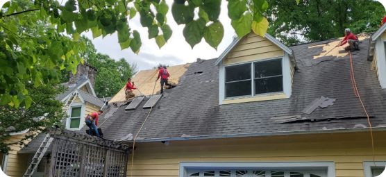 a home with a shingle roof being repaired