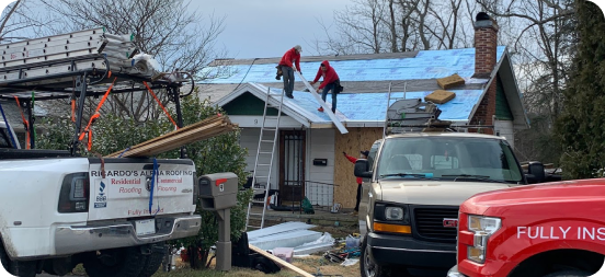 a metal roof being installed on a home